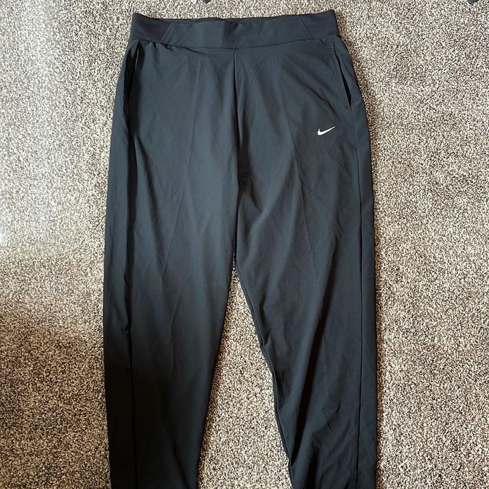 black pants from nike made with breathable dri-fit material